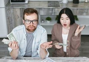 Couple that is shocked about cost while holding money