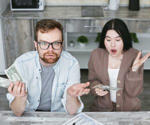 Couple that is shocked about cost while holding money